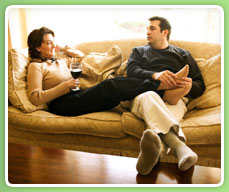 image of a couple sitting comfortably on a couch